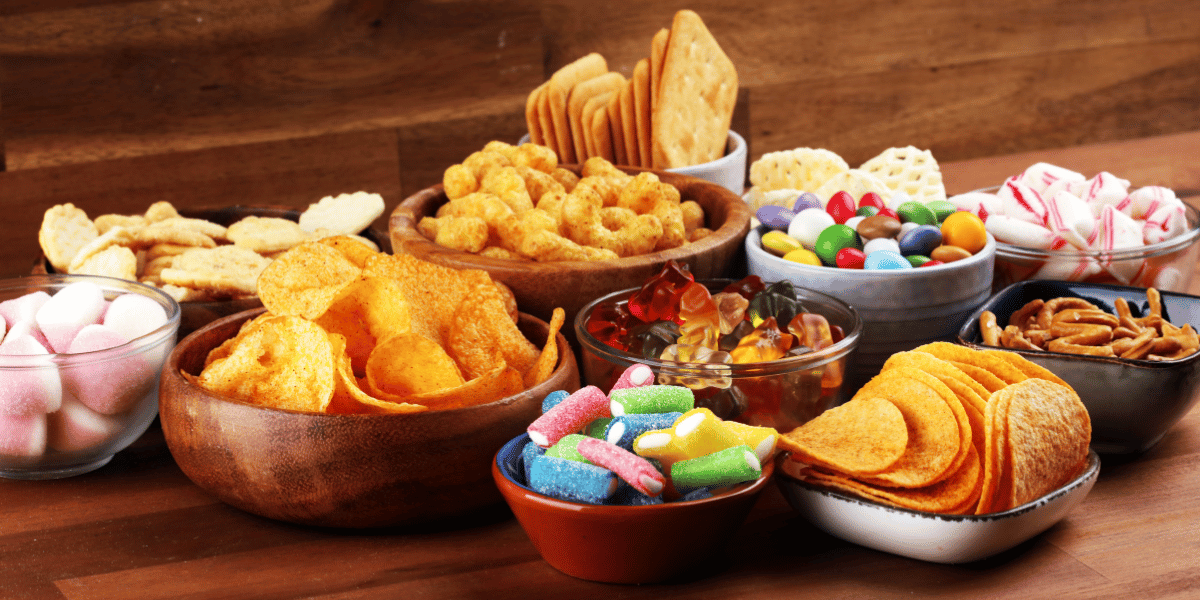 a variety of ultra processed foods, from bread products to chips, candy, and more