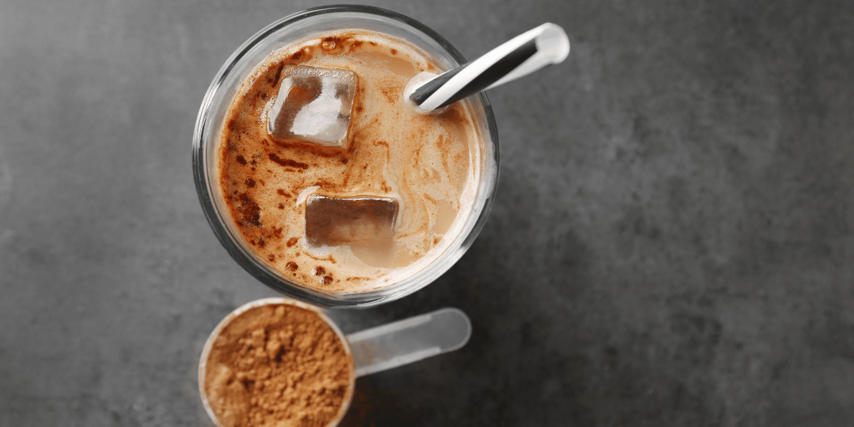 protein powder scoop next to shake