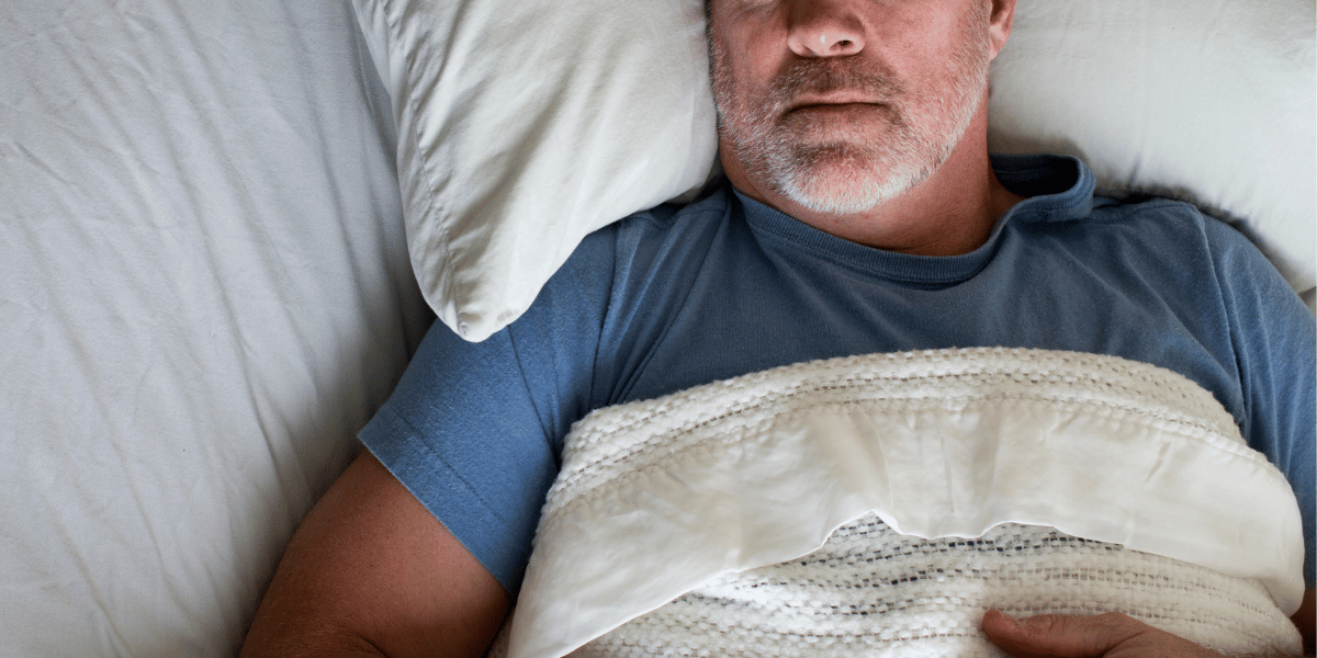 a man asleep in bed