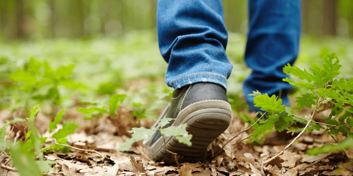 feet walking on an outdoor trail